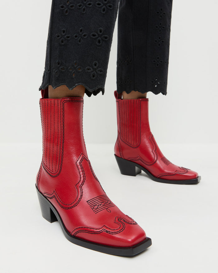Agnes Red Leather Western Boot in red vachetta leather and Demi Embroidered Pant in black denim.