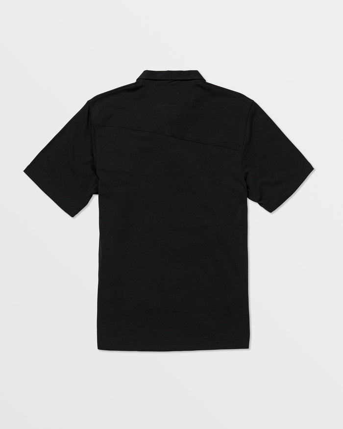 The Volcom Kids' Wowzer Polo Short Sleeve Tee, a plain black modern fit shirt, is displayed from the back and laid flat on a white background.