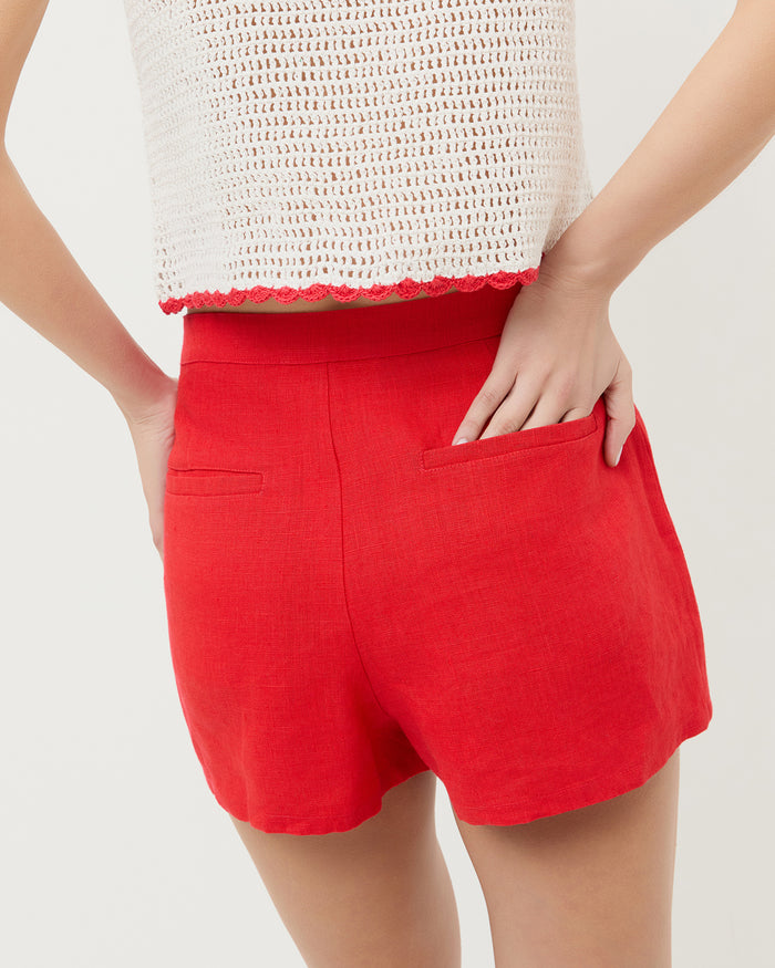 Carissa Short in red linen and Juliette Top in white crochet.