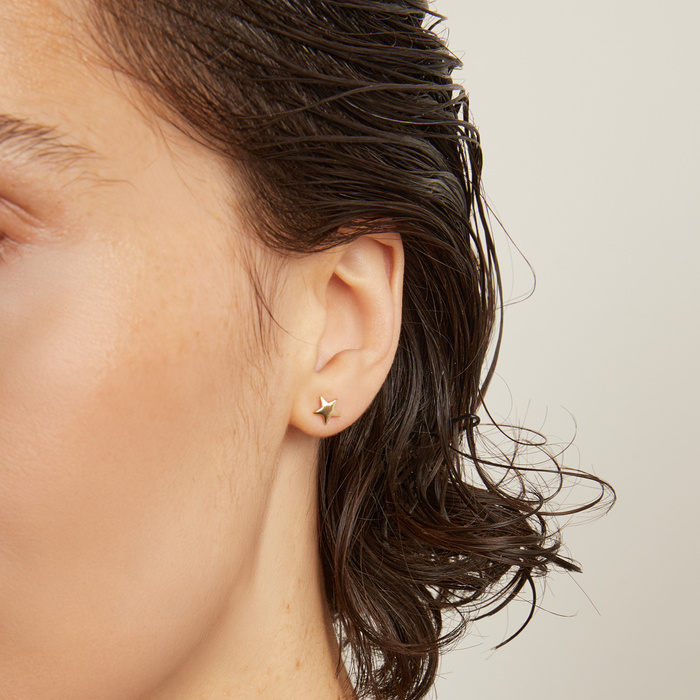 Model. Close up of star earring
