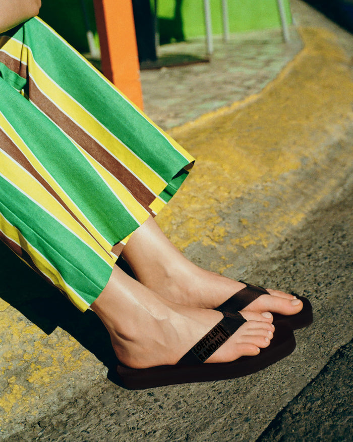 Pasha Trouser in green/yellow/brown striped cotton-linen and Chase Brown Flip Flop.