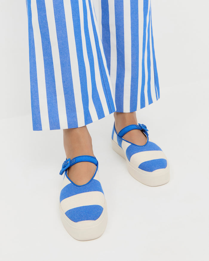 Cooper Blue Striped Mary Jane Sneaker in blue and cream striped canvas and Pasha Trouser in blue and cream striped cotton-linen.