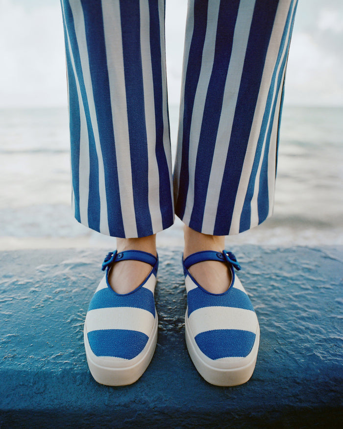 Cooper Blue Striped Mary Jane Sneaker in blue and cream striped canvas and Pasha Trouser in blue and cream striped cotton-linen.