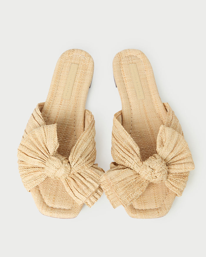Daphne Natural Bow Slide Sandal in natural tan straw.