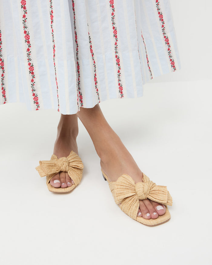 Daphne Natural Bow Slide Sandal in natural tan straw.
