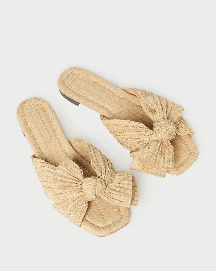 Daphne Natural Bow Slide Sandal in natural tan straw.