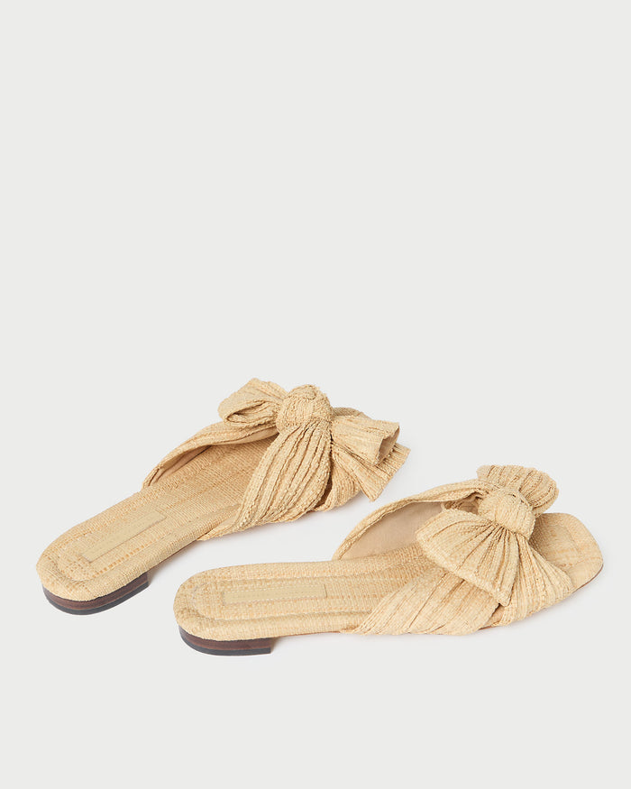 Daphne Natural Bow Slide Sandal in natural tan straw.