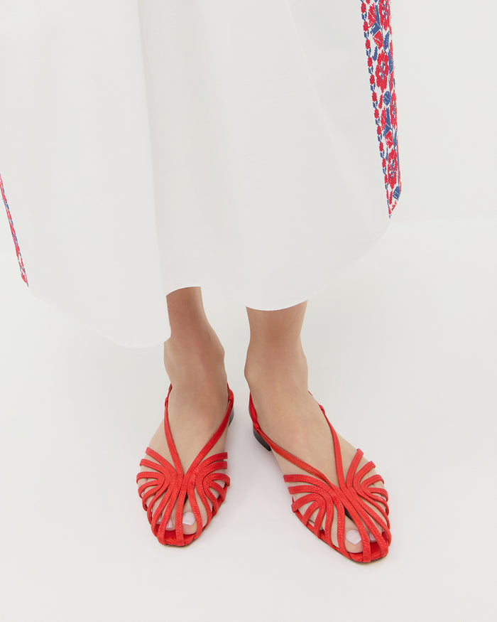 Devon Red Moiré Slingback Sandal red moiré and Lotus Embroidered Dress in white cotton with red and blue floral embroidery.