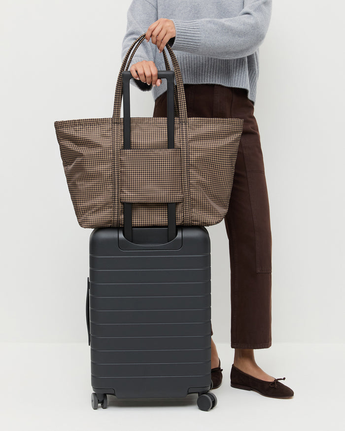 Dina Brown/Black Check Travel Tote in brown and black check nylon, Lana Cashmere Sweater in grey cashmere, and Molly Workweark Jean in brown denim.