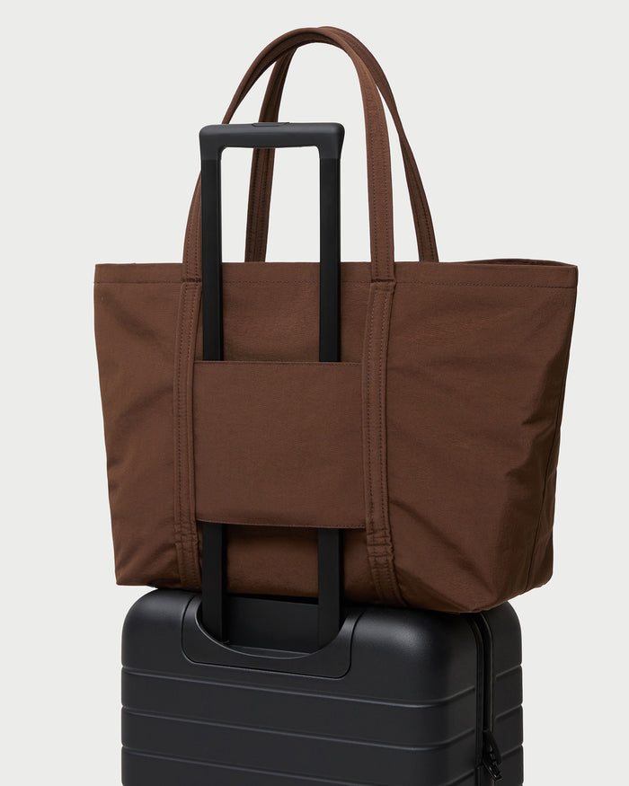 Dina Chocolate Travel Tote in chocolate brown water-resistant nylon.