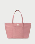 Dina Pink Travel Tote in pink water-resistant nylon.