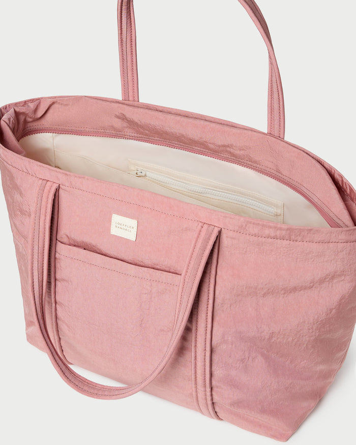 Dina Pink Travel Tote in pink water-resistant nylon.