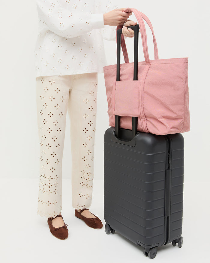 Dina Pink Travel Tote in pink water-resistant nylon, Demi Embroidered Pant and natural cotton, Leonie Espresso Suede Ballet Flat.