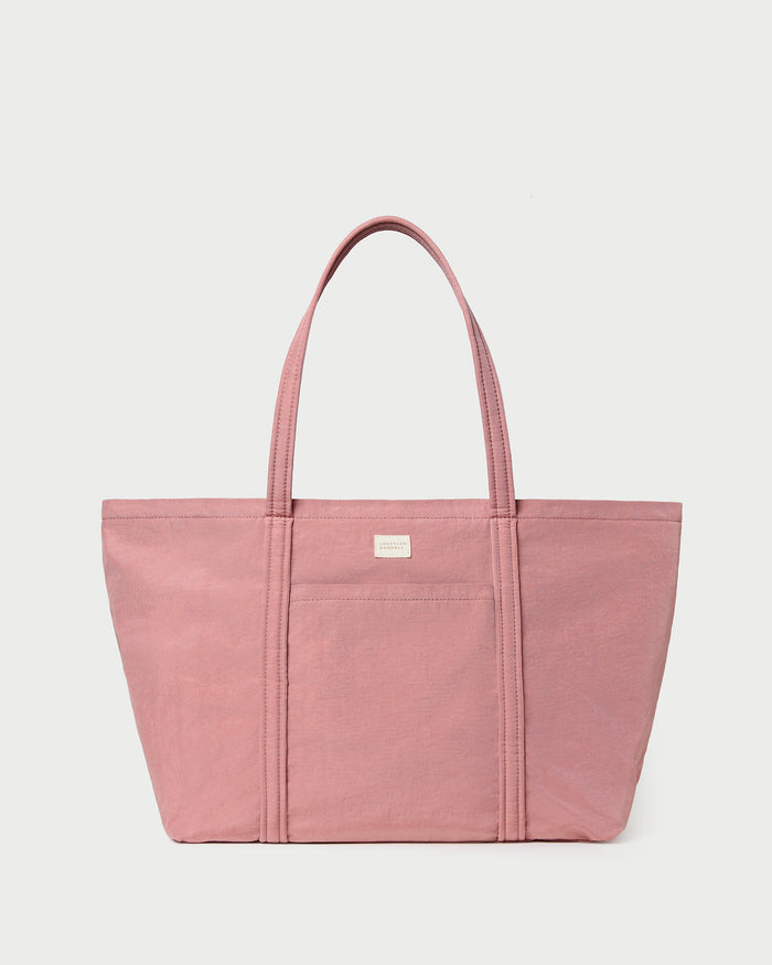 Dina Pink Travel Tote in pink water-resistant nylon.