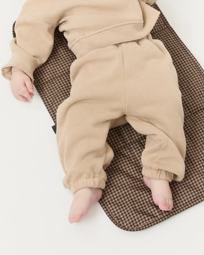 Dottie Brown/Black Check Changing Pad in brown/black check nylon.