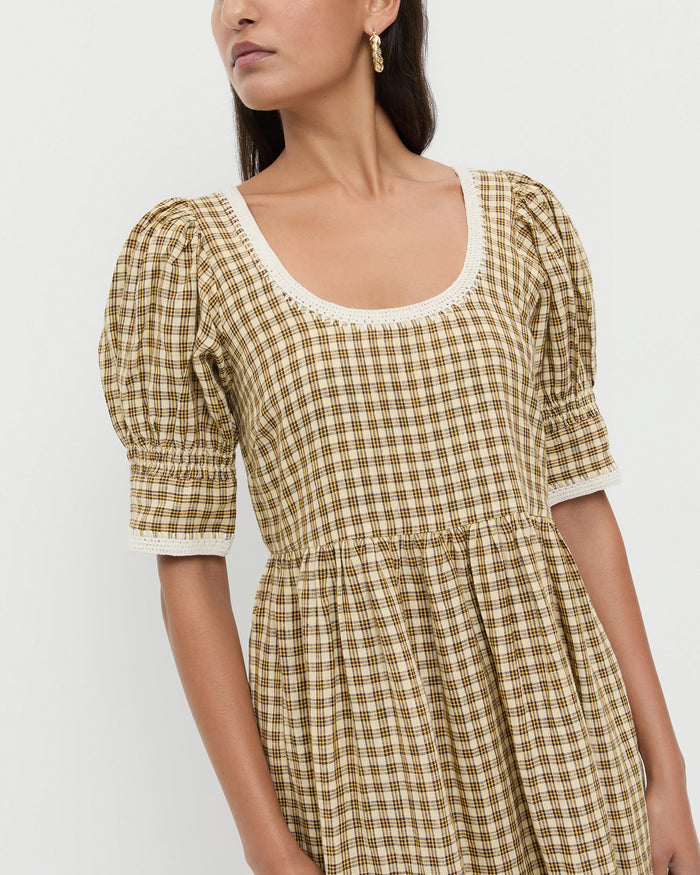 Gillian Puff-Sleeve Dress in brown butter plaid linen.