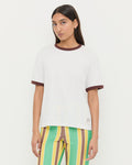 Harly Tee in white cotton with brown accents and Pasha Trouser in green/yellow striped cotton-linen.