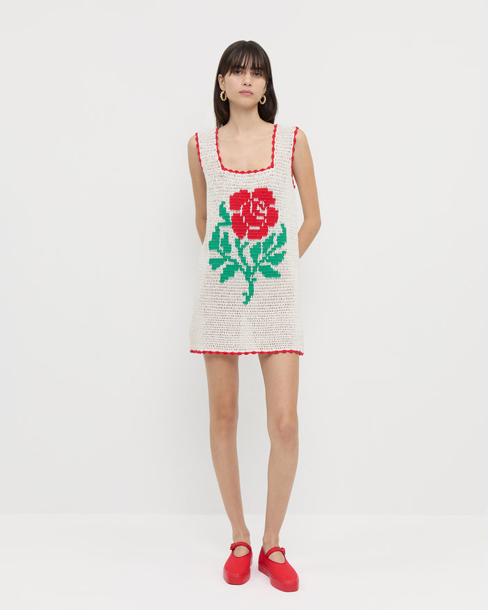 Helena Crochet Dress in cream hand-crocheted cotton with a red flower detail and Cooper Red Mary Jane Sneaker.