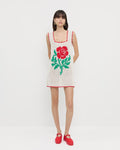 Helena Crochet Dress in cream hand-crocheted cotton with a red flower detail and Cooper Red Mary Jane Sneaker.
