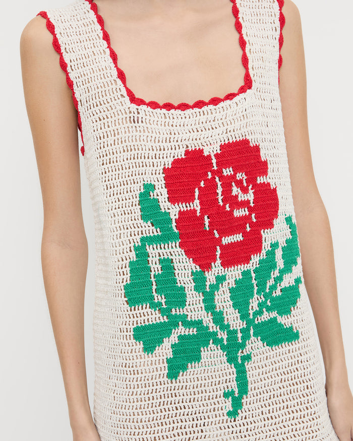 Helena Crochet Dress in cream hand-crocheted cotton with a red flower detail.