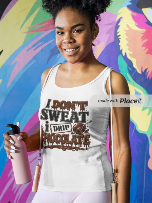 A woman wearing a white tank top with a brown chocolate-themed graphic that reads 'I DON'T SWEAT I DRIP CHOCOLATE' stands in front of a colorful graffiti-style mural. She is holding a pink water bottle.