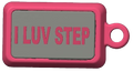 A pink rectangular keychain or tag with a gray center panel and the words 'I LUV STEP' in pink raised lettering, shown on a plain white background.