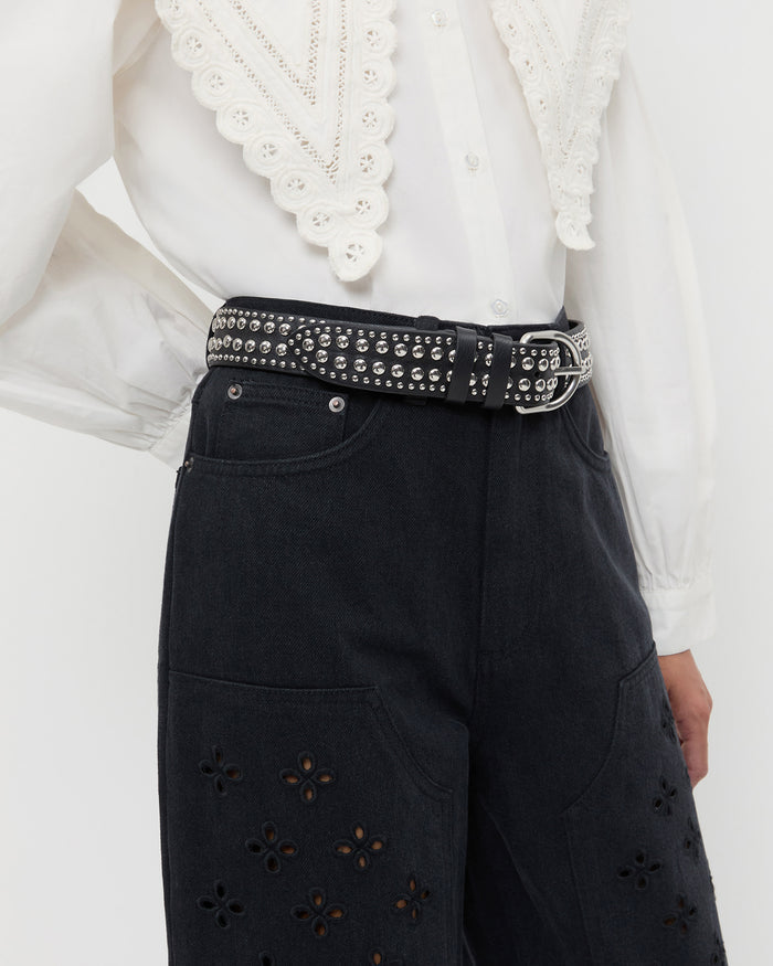 Isaac Black/Silver Studded Belt in black leather with silver studs, Ken Shirt in white cotton, and Demi Embroidered Pant in black.