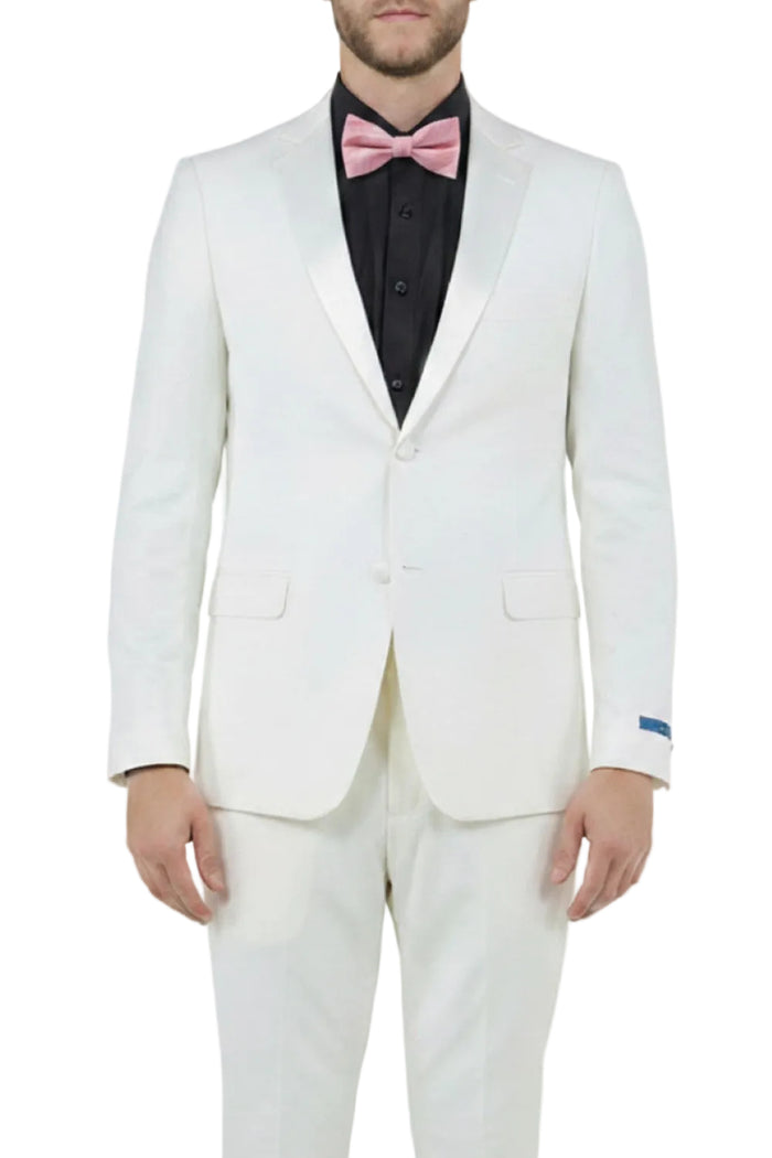 White suit with a black shirt and pink bow tie on a white background