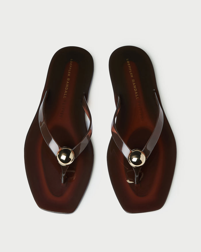 Jovie Brown Jelly Flip Flop in brown jelly with gold accent.