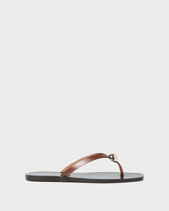 Jovie Brown Jelly Flip Flop in brown jelly with gold accent.