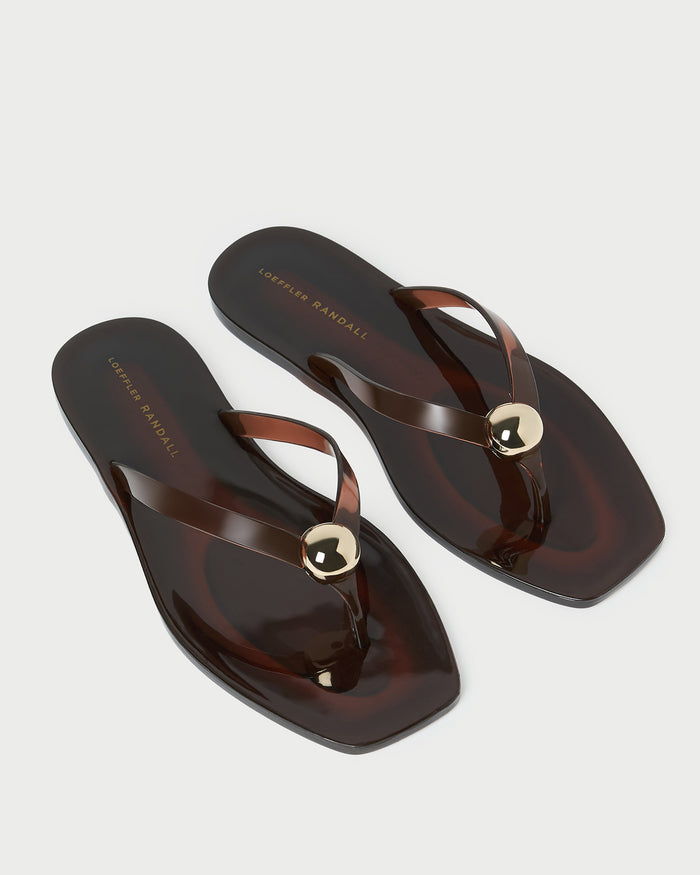 Jovie Brown Jelly Flip Flop in brown jelly with gold accent.