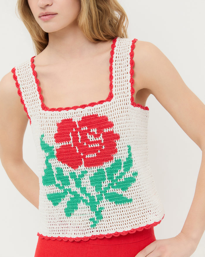 Juliette Top in white hand crocheted cotton with a flower accent and Carissa Short in red linen.
