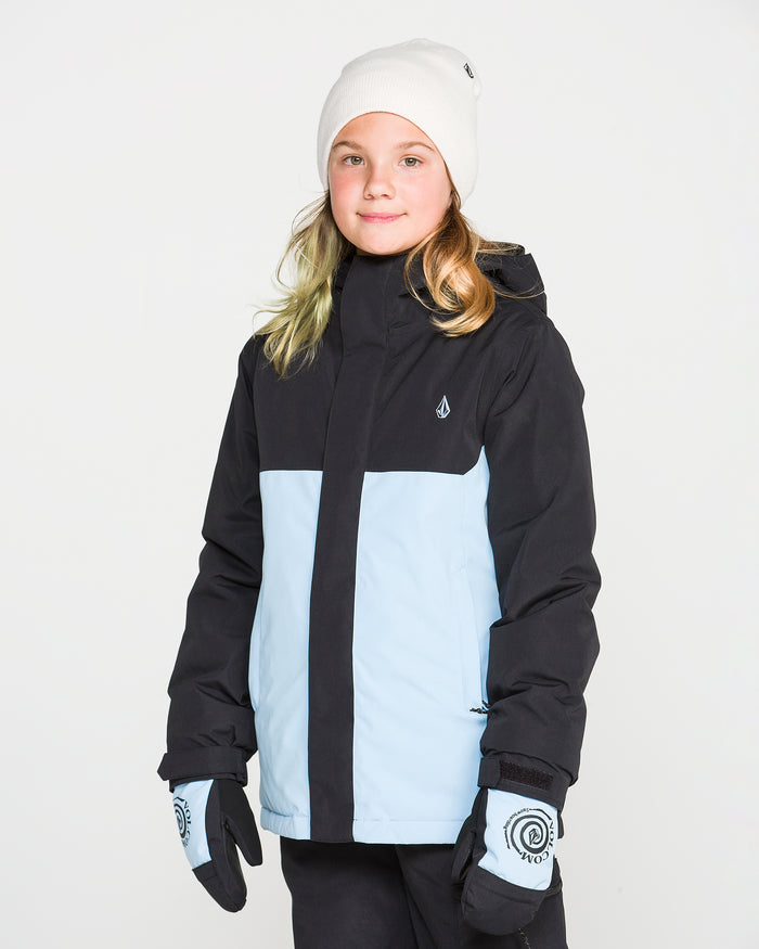 A child wearing a white beanie and patterned gloves stands facing forward against a plain white background, dressed in the Volcom Kids’ Sass’N’Frass Insulated Jacket in black and light blue—crafted from recycled polyester and finished with a PFAS-free DWR for cozy winter warmth.