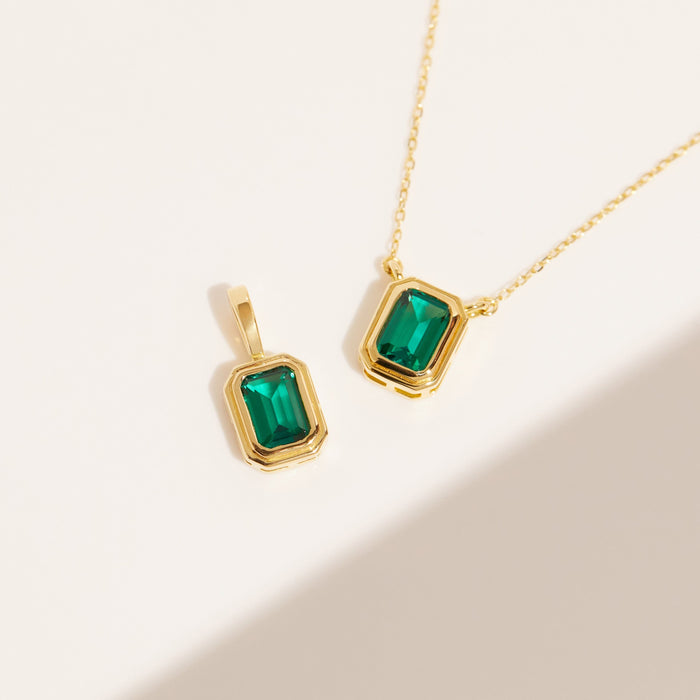 Flatlay Model two green stones necklaces on a flat white surface