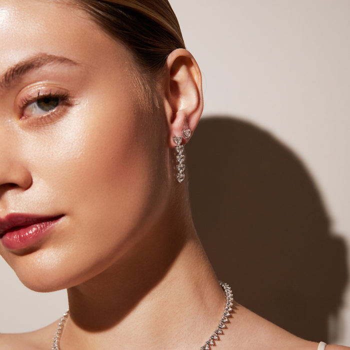 Model close up of woman wearing stone dangle earring