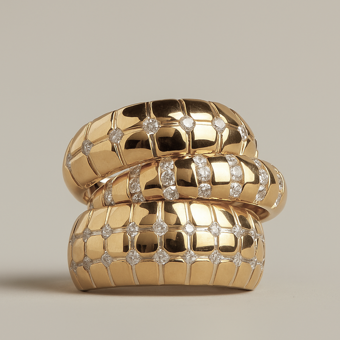 Model. Gold ring with diamond accents on a beige background