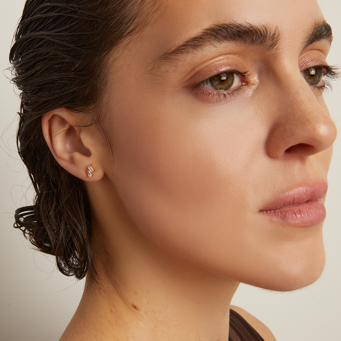 Model. Close-up of a woman's face with a neutral background