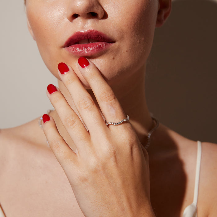 Model. Close up of woman wearing gemstone ring