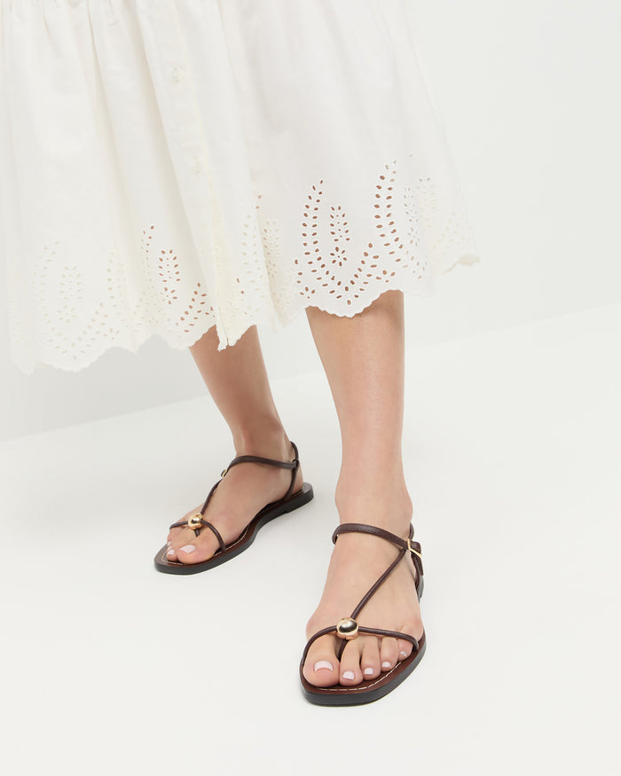 Lara Espresso Leather Sandal in espresso brown leather with a gold ball accent and Thelma Eyelet Dress in cream cotton.