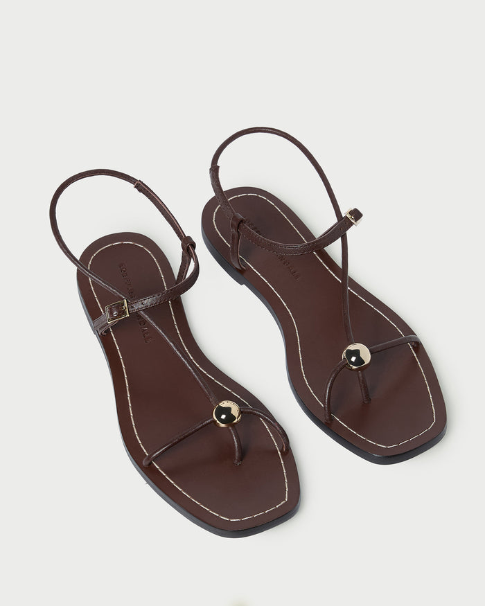 Lara Espresso Leather Sandal in espresso brown leather with a gold ball accent.