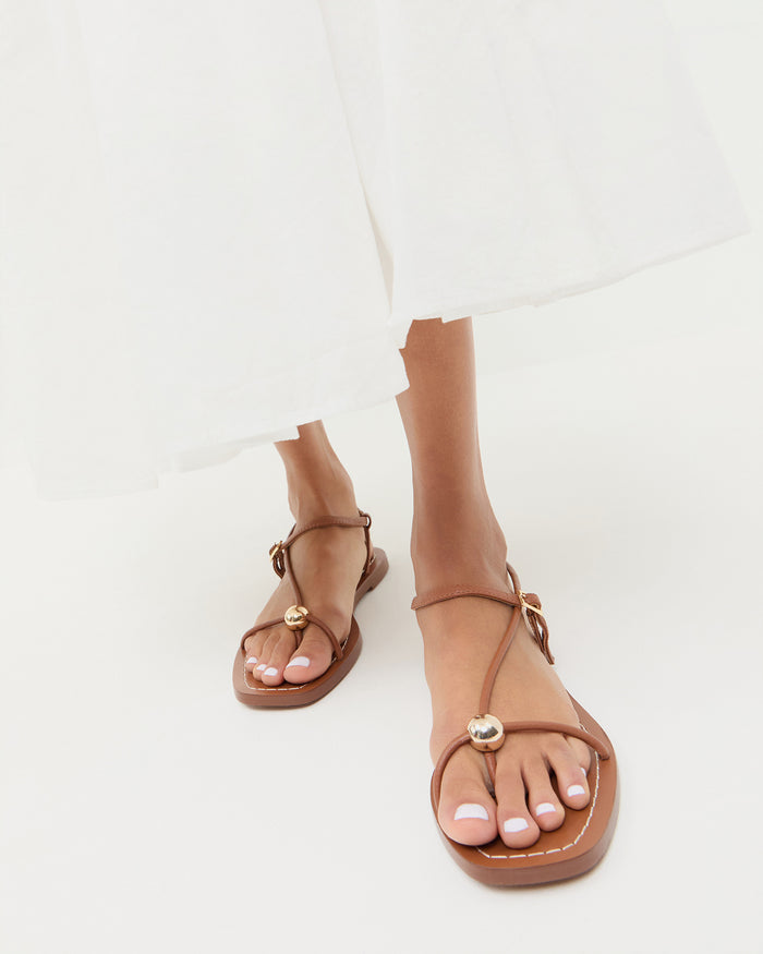 Lara Timber Leather Sandal in timber brown leather with a gold ball accent.