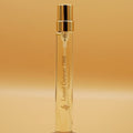 A clear glass 8ml travel sprayer with a gold cap labeled 'Laurel Canyon , 1966'