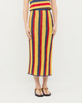 Lela Crochet Skirt in yellow, red, and navy striped hand-crocheted cotton, Prescott Crochet Top in yellow, red, and navy striped hand-crocheted cotton, and Mika Maroon/Yellow Sport Sandal.