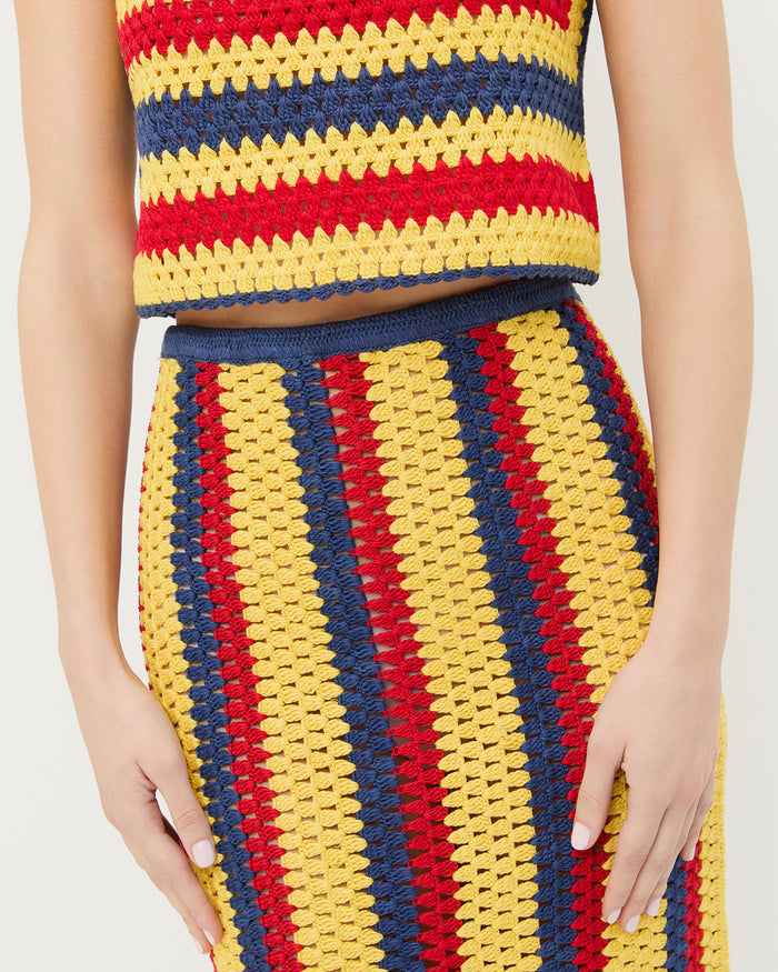 Lela Crochet Skirt in yellow, red, and navy striped hand-crocheted cotton and Prescott Crochet Top in yellow, red, and navy striped hand-crocheted cotton.