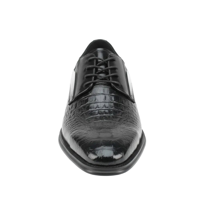 Black dress shoe with crocodile texture on a white background