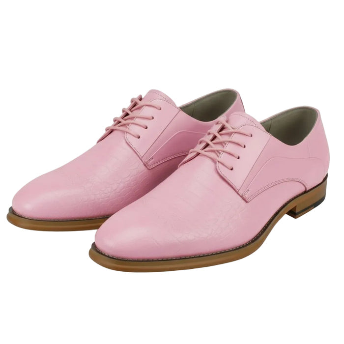 Pair of pink leather shoes with brown soles on a white background