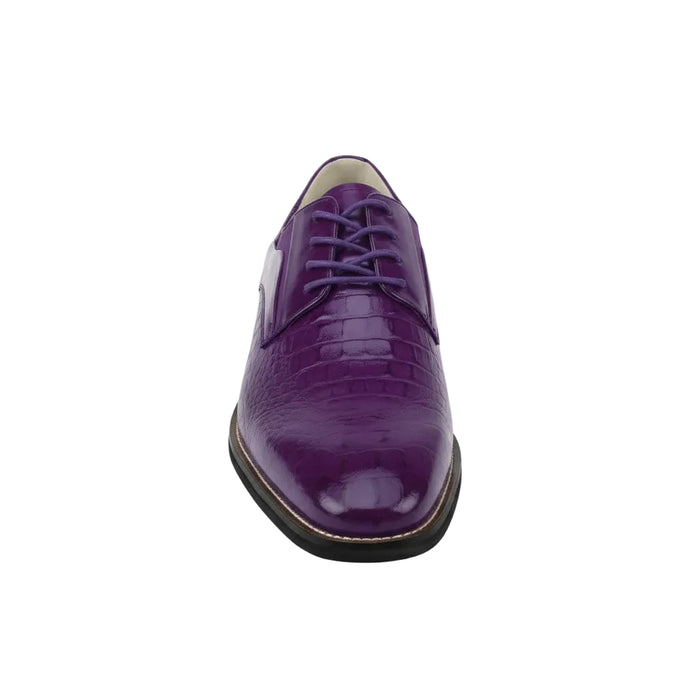 Purple leather shoe on a white background