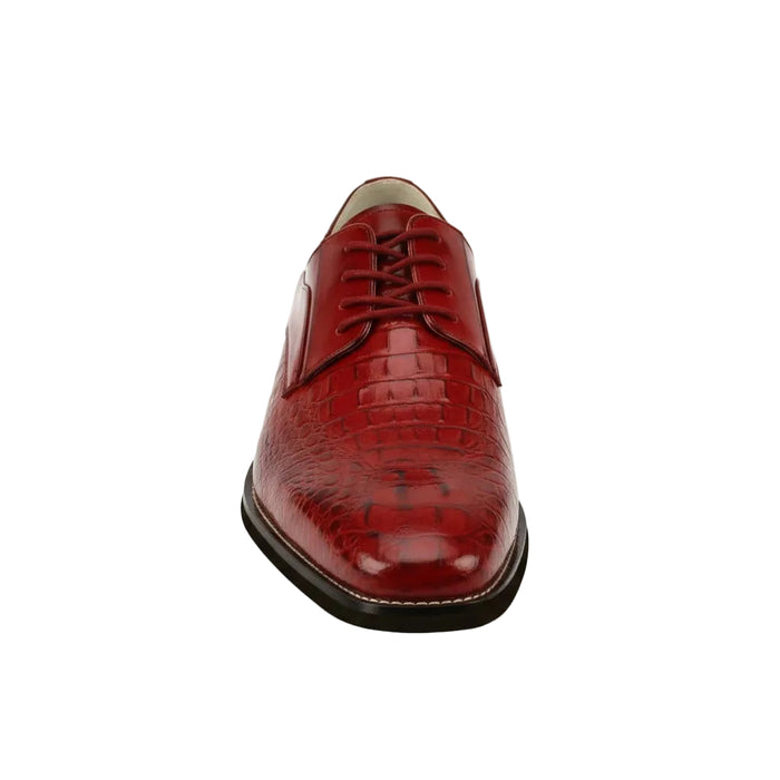 Red leather dress shoe on a white background