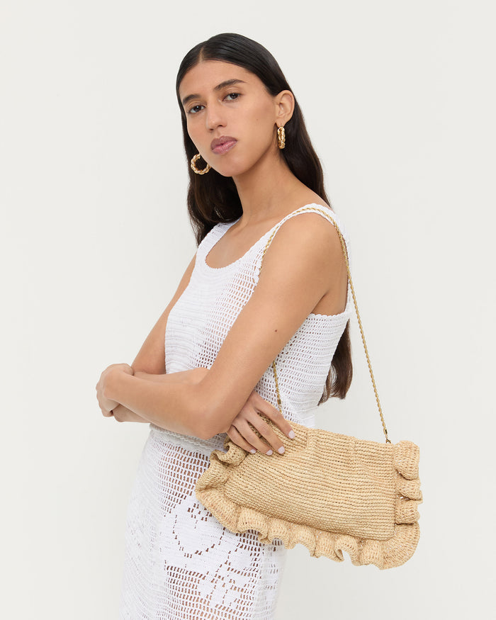 Mavis Natural Raffia Ruffle Clutch in natural raffia, Aurelie Sleeveless Top in white crochet cotton, and Sullivan Crochet Skirt white crochet cotton.