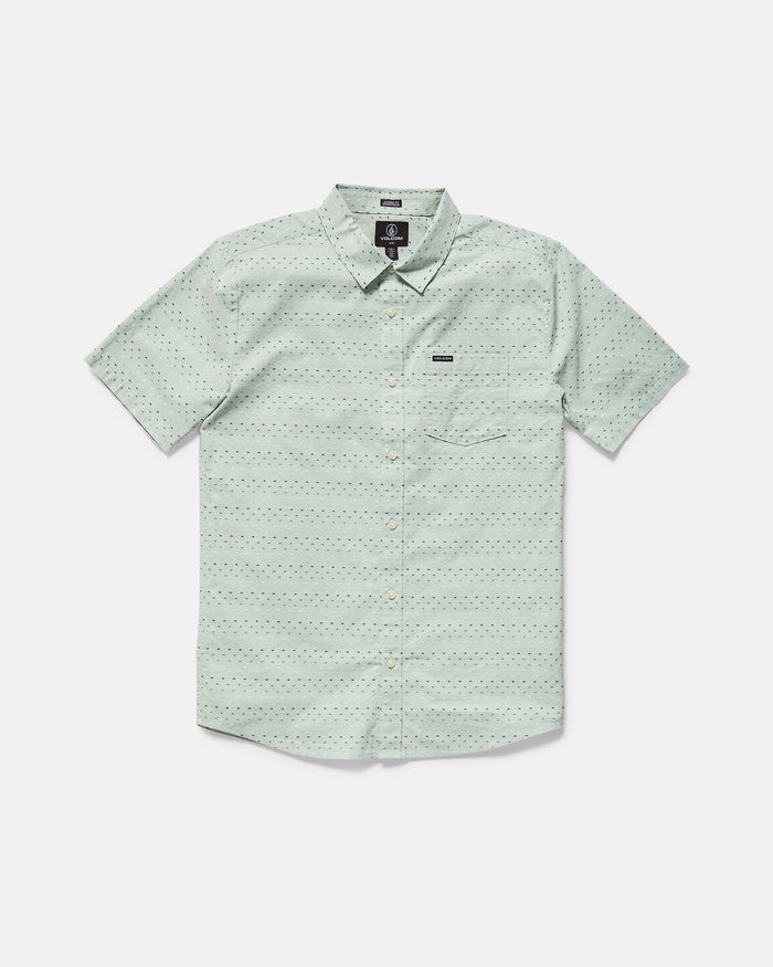 The Men's Bankstone II Short Sleeve Tee by Volcom features a light green color, classic fit, crew neck, and single chest pocket. This textured tee is laid flat on a white background.